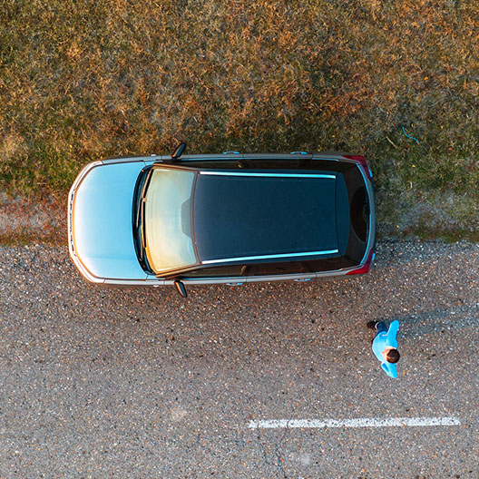 bird's eye view of a car pulled over on the side of the road