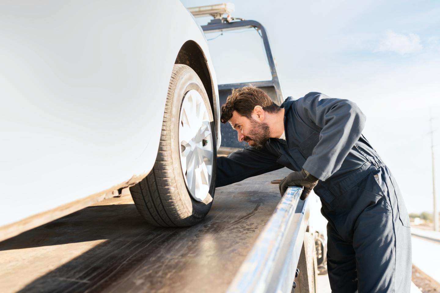 car-being-towed-white