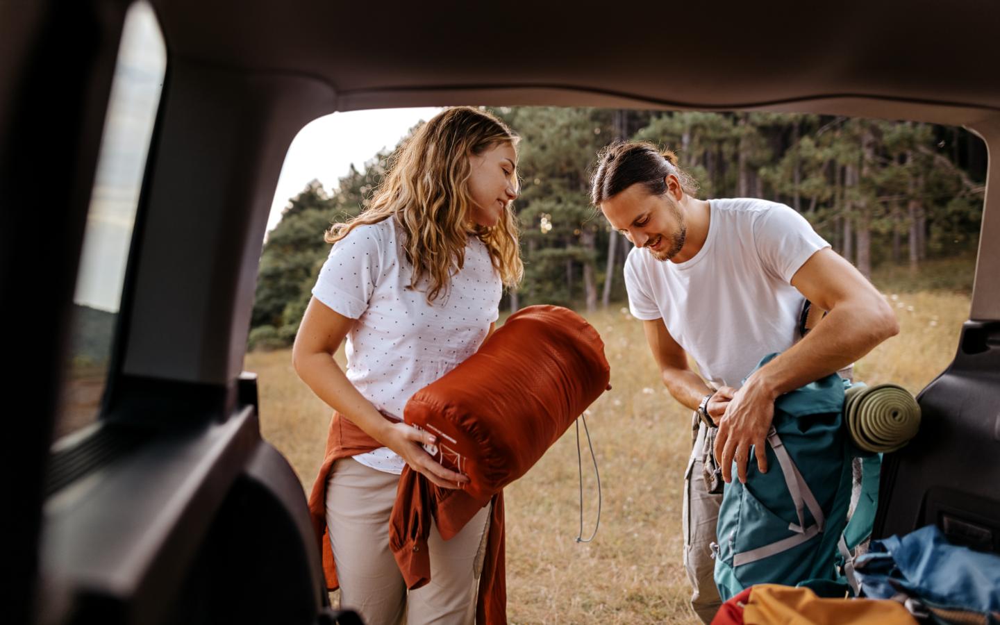 Couple camping in car